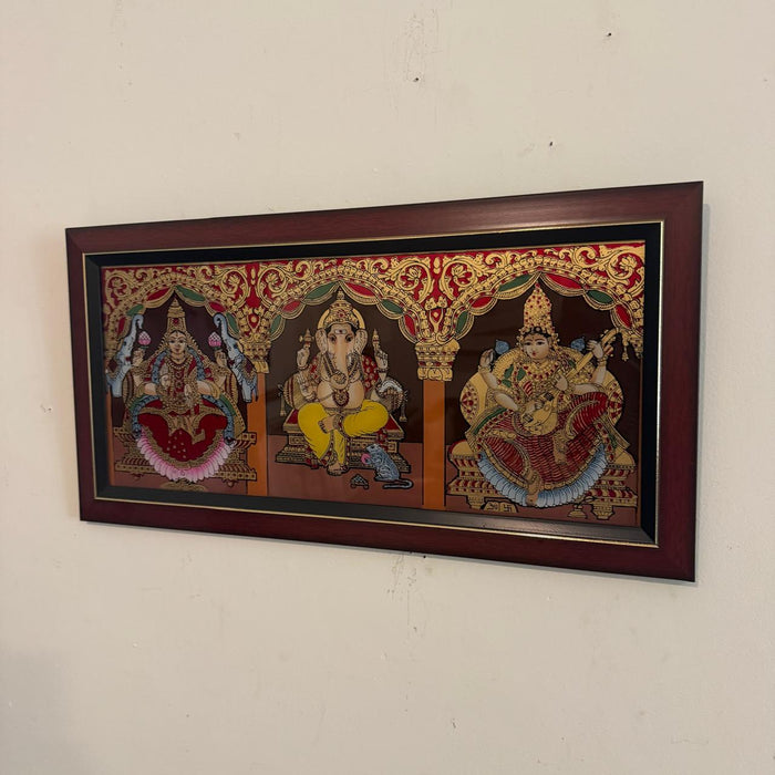 Wooden framed glass Tanjore : Ganesh, Lakshmi & Saraswati