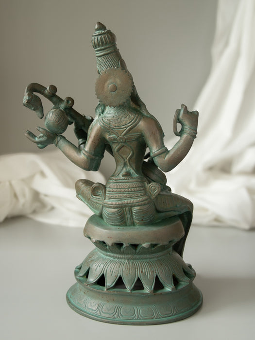 Maa Saraswati 
Brass Idol Sitting On Lotus Base