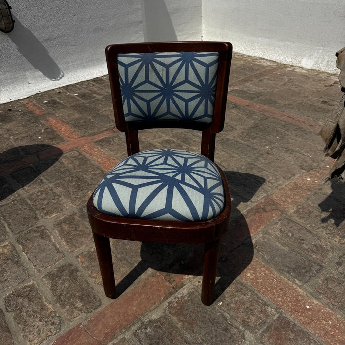 Single Vintage Chair with a curved seat