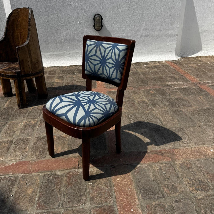 Single Vintage Chair with a curved seat