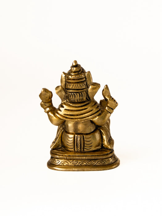 Brass Ganesha Sitting on a Decorative Base