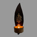 Wax candle holder shaped like a leaf on a textured wall