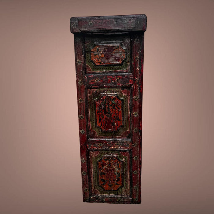 Vintage wooden panel with intricate carvings on a brown background